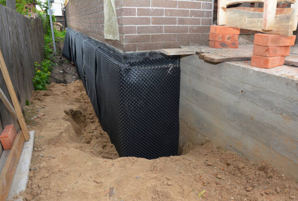 Happy homeowners after waterproofing job in Monkton